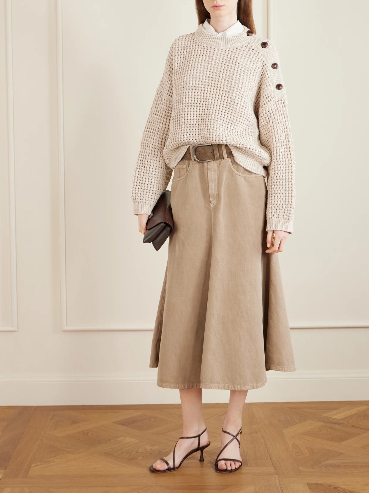 Image of a model wearing Skirts. Product name - Cotton And Linen-blend Twill Midi Skirt in Beige colour by brand - Brunello Cucinelli