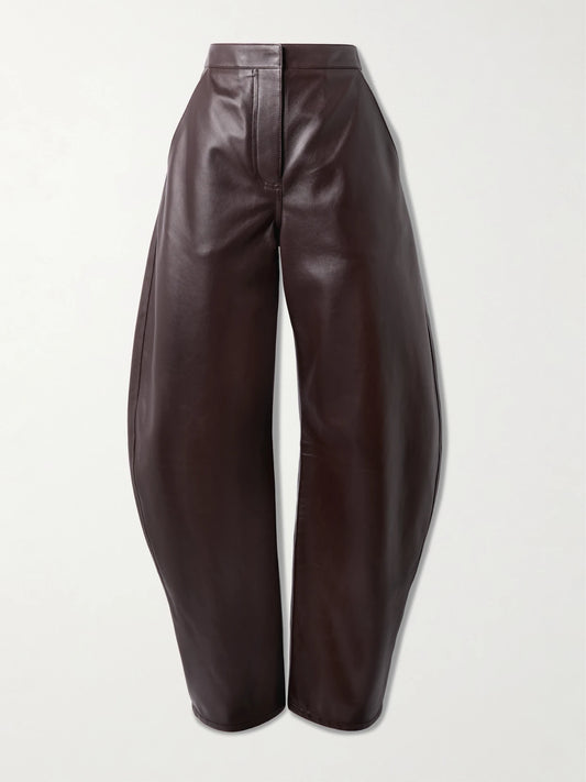 Image of a model wearing Pants. Product name - Leather Barrel-leg Pants in Dark brown colour by brand - Alaïa