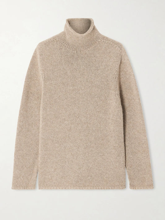 Image of a model wearing Outerwear. Product name - Mariam Turtleneck Cashmere Sweater in Taupe colour by brand - The Row