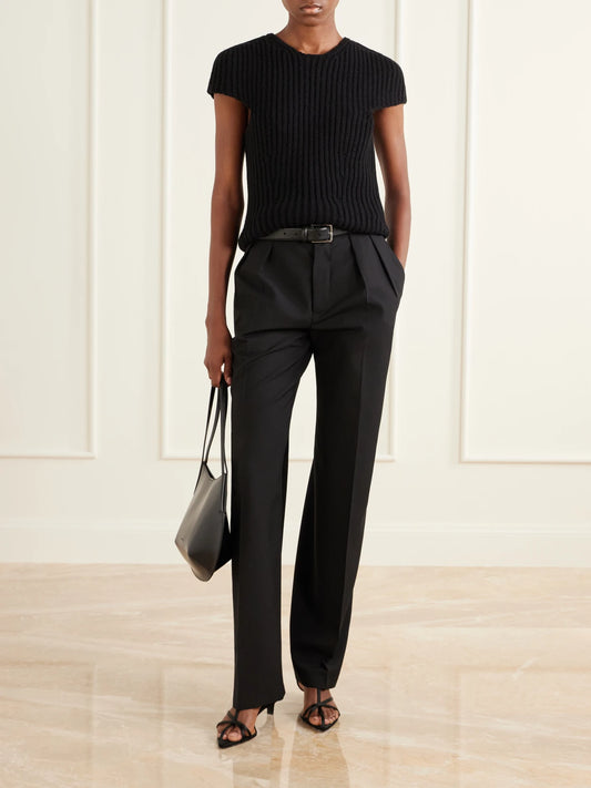 Image of a model wearing Tops. Product name - Ribbed Wool Blouse in Black colour by brand - Jil Sander