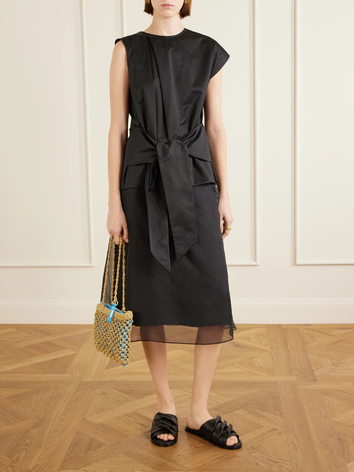 Image of a model wearing Tops. Product name - Tie-detailed Cotton Top in Black colour by brand - JW Anderson