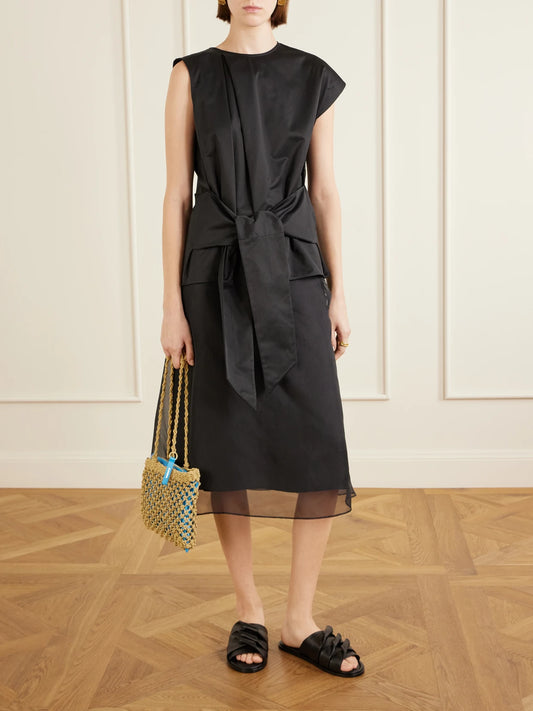 Image of a model wearing Tops. Product name - Tie-detailed Cotton Top in Black colour by brand - JW Anderson
