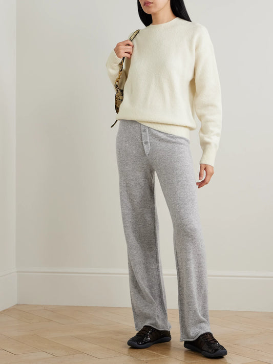 Image of a model wearing Outerwear. Product name - Brock Cashmere-blend Sweater in Cream colour by brand - ÉTERNE
