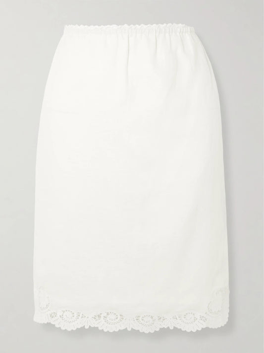 Image of a model wearing Skirts. Product name - Darya Lace-trimmed Linen And Cotton-blend Midi Skirt in Cream colour by brand - Posse