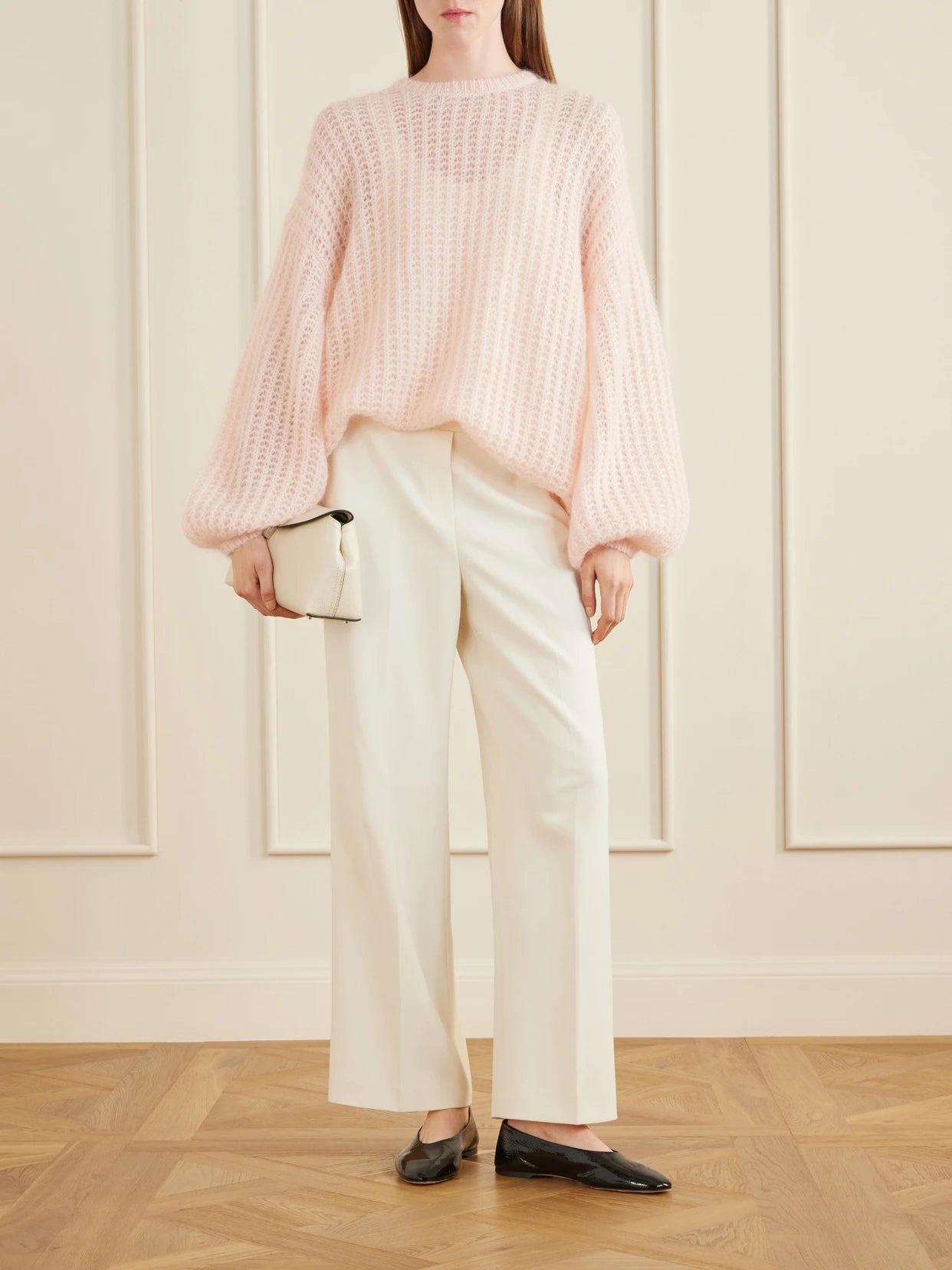 Image of a model wearing Outerwear. Product name - Open-knit Mohair-blend Sweater in Baby pink colour by brand - TOTEME