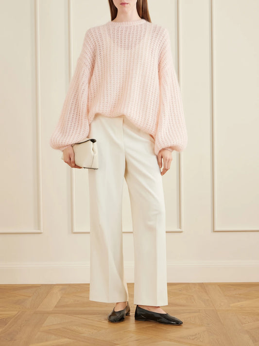 Image of a model wearing Outerwear. Product name - Open-knit Mohair-blend Sweater in Baby pink colour by brand - TOTEME