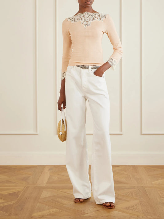 Image of a model wearing Tops. Product name - Riana Lace-trimmed Cotton-blend Jersey T-shirt in Cream colour by brand - DÔEN