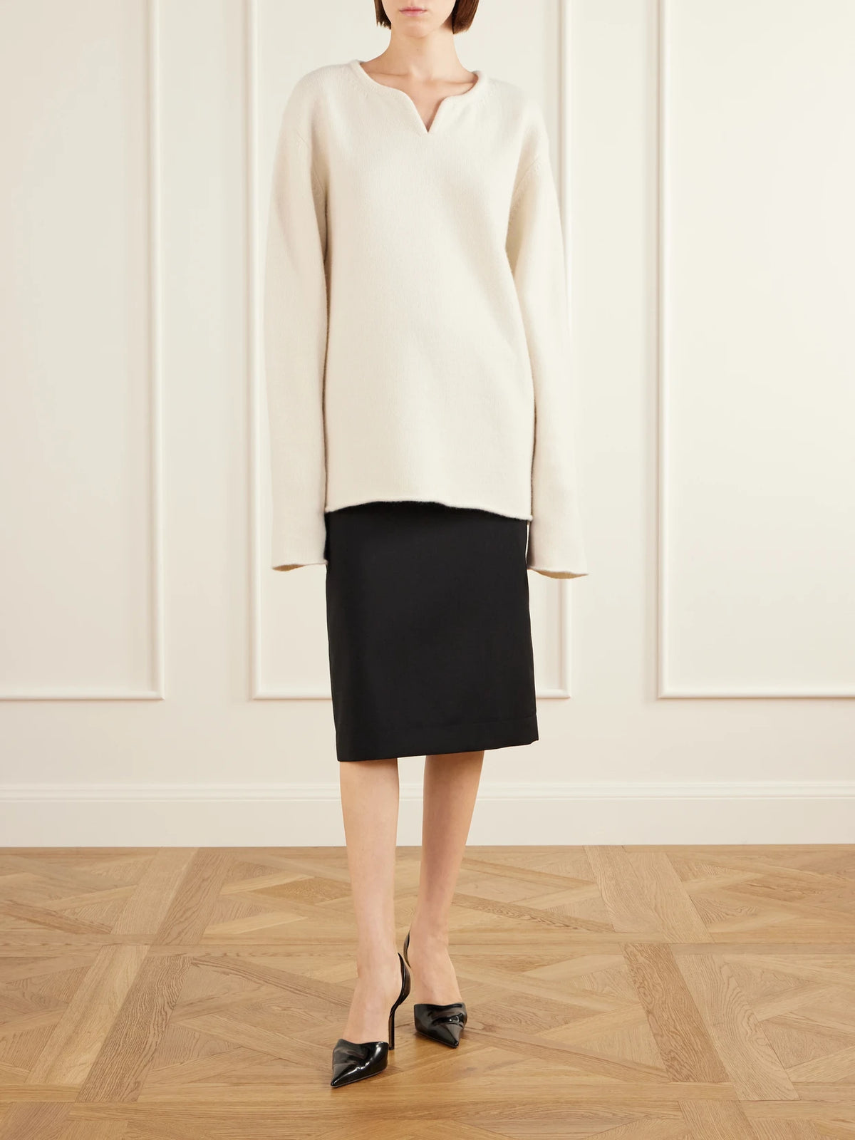 Image of a model wearing Outerwear. Product name - Christelle Cashmere Sweater in White colour by brand - Calvin Klein Collection