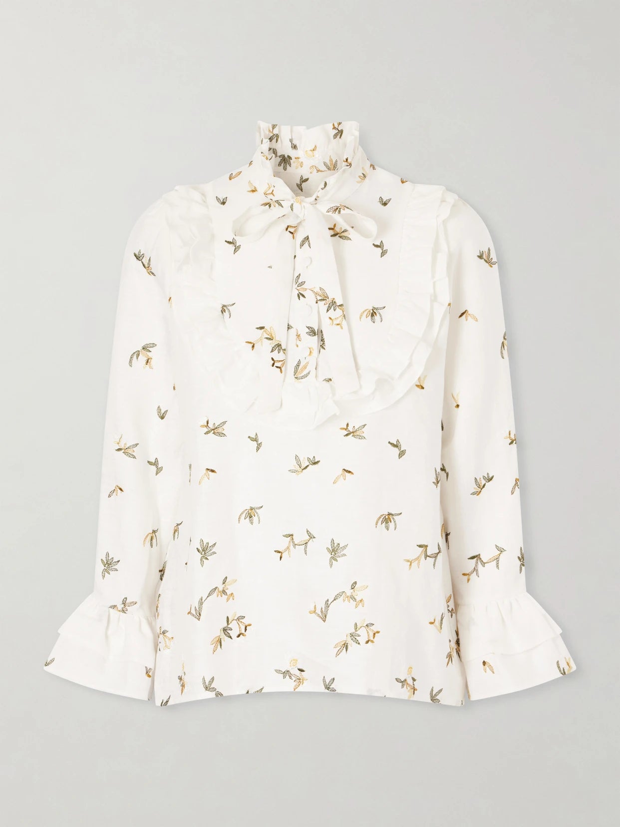 Image of a model wearing Tops. Product name - Valeria Ruffled Embroidered Linen Blouse in White colour by brand - Cristiano Marcheli