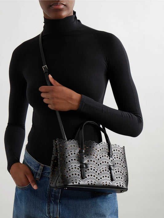 Image of Bags. Product name - Mena 25 E/w Medium Laser-cut Leather Tote in Black colour by brand - Alaïa