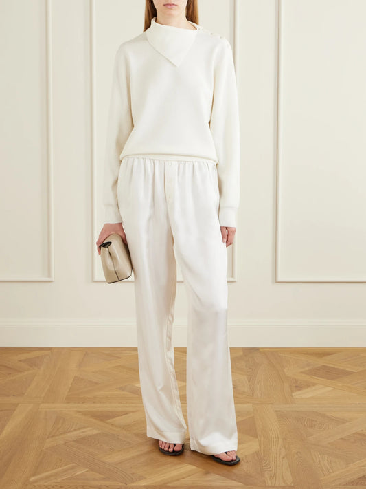 Image of a model wearing Outerwear. Product name - Asymmetric Merino Wool-blend Sweater in Off-white colour by brand - RÓHE