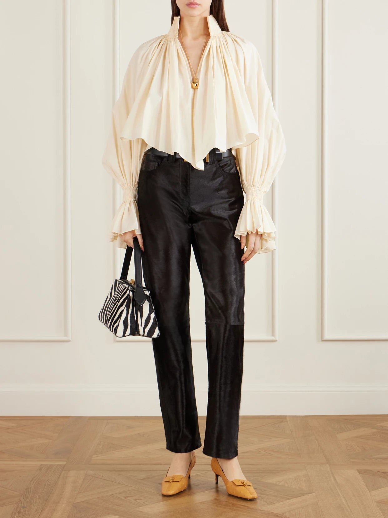 Image of a model wearing Pants. Product name - Callum Calf Hair Straight-leg Pants in Black colour by brand - KHAITE