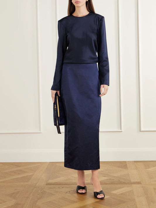 Image of a model wearing Skirts. Product name - Sandrita Duchess Silk-satin Maxi Skirt in Midnight blue colour by brand - Heirlome