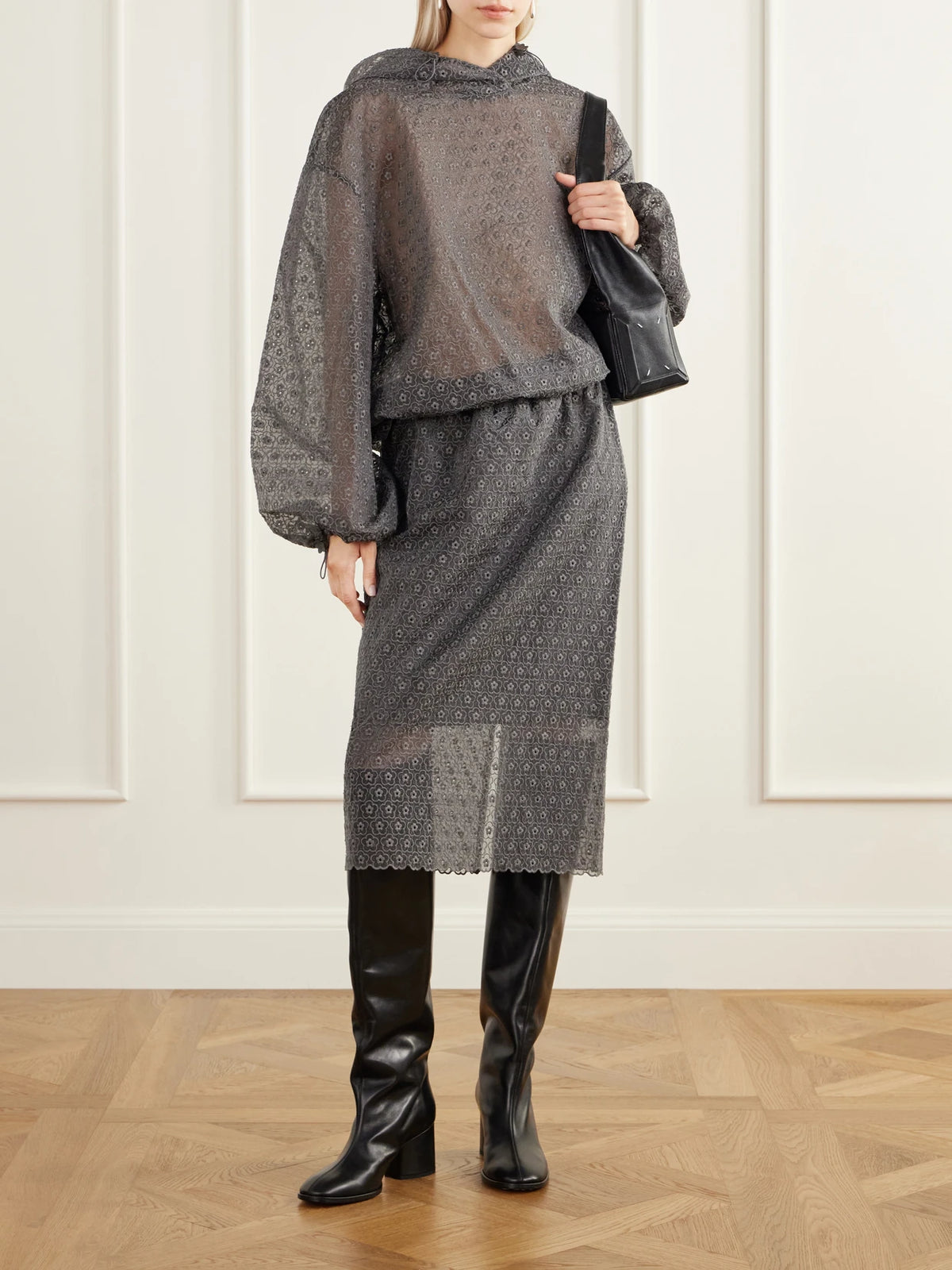 Image of a model wearing Skirts. Product name - Bria Scalloped Cotton-blend Floral-lace Midi Skirt in Gray colour by brand - Cecilie Bahnsen
