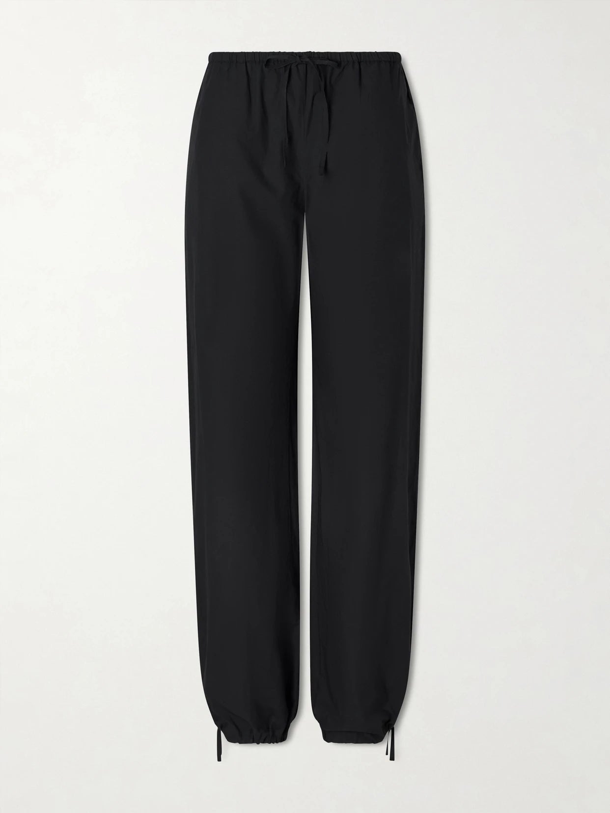 Image of a model wearing Pants. Product name - Petri Cotton-poplin Balloon Trousers in Black colour by brand - SKALL