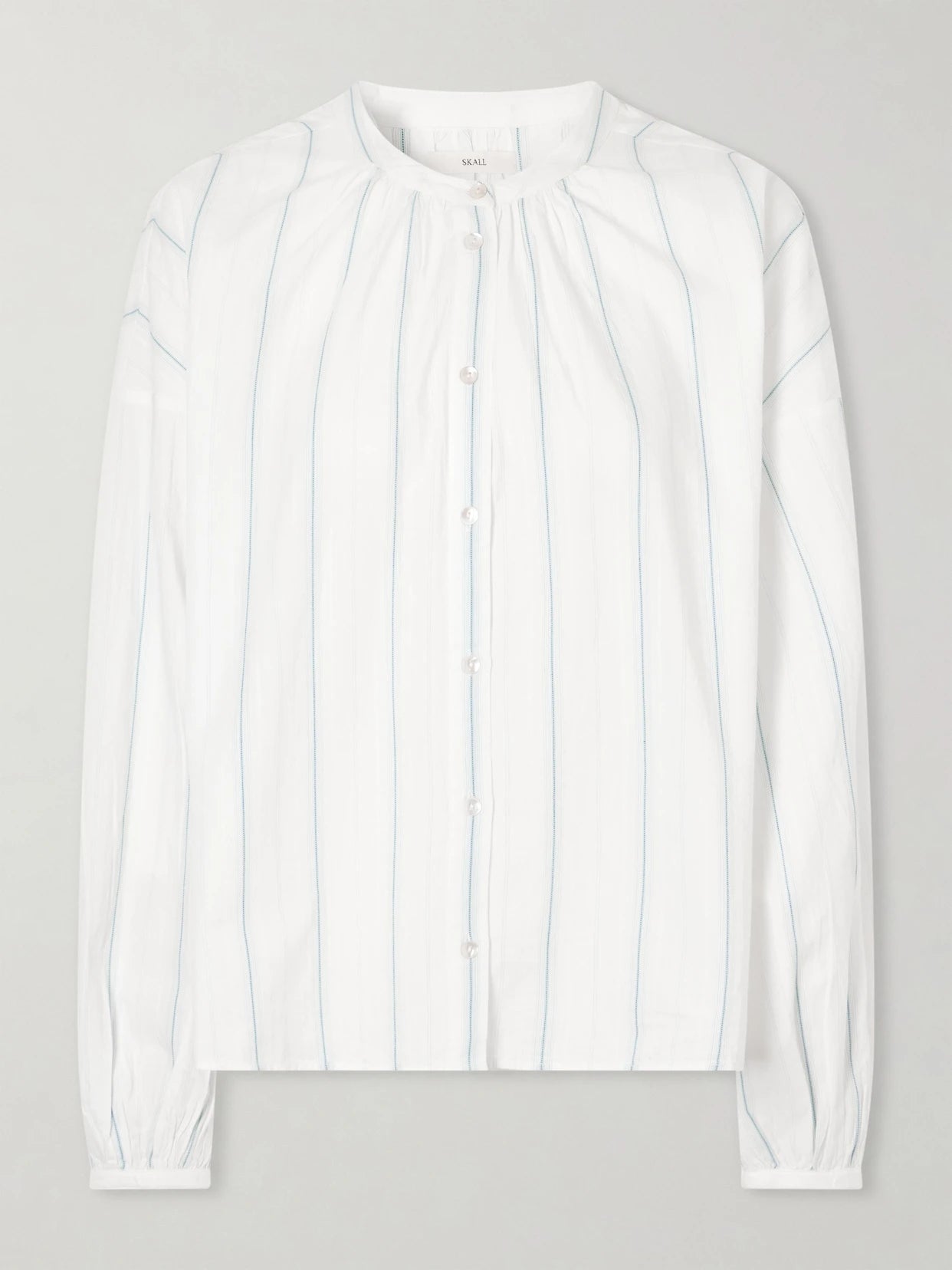 Image of a model wearing Tops. Product name - Cilla Striped Organic Cotton Shirt in White colour by brand - SKALL