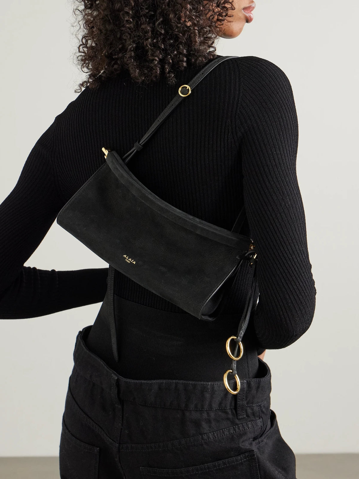 Image of Bags. Product name - Click E/w Small Textured-nubuck Shoulder Bag in Black colour by brand - Alaïa