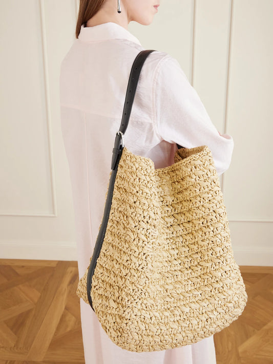 Image of Bags. Product name - Leather-trimmed Raffia Shoulder Bag in Cream colour by brand - TOTEME