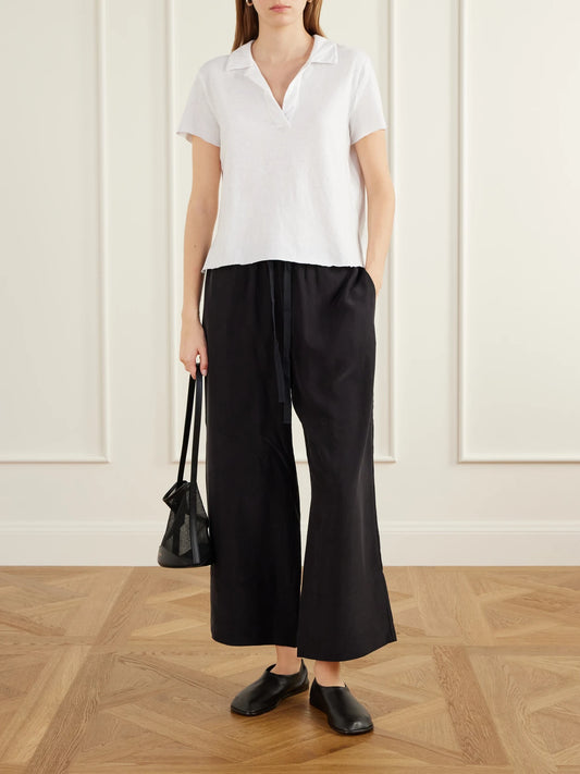 Image of a model wearing Tops. Product name - Cotton-piqué Polo Shirt in White, Dark gray colour by brand - James Perse