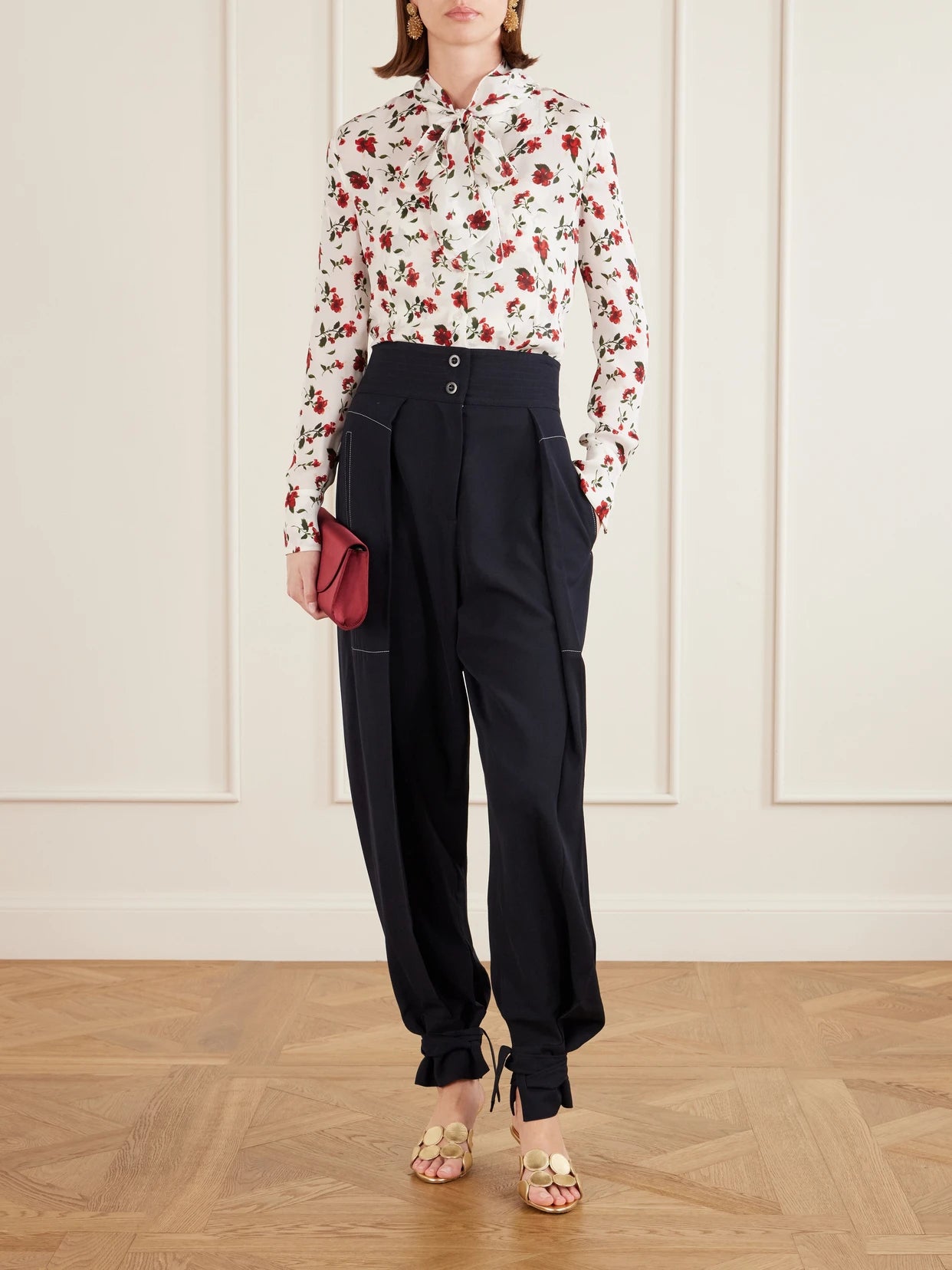 Image of a model wearing Tops. Product name - Hibiscus Floral-print Silk Blouse in White colour by brand - Oscar de la Renta