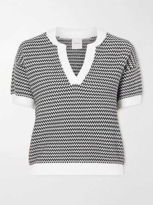 Image of a model wearing Outerwear. Product name - Dora Striped Knitted Cotton Top in Black colour by brand - Varley