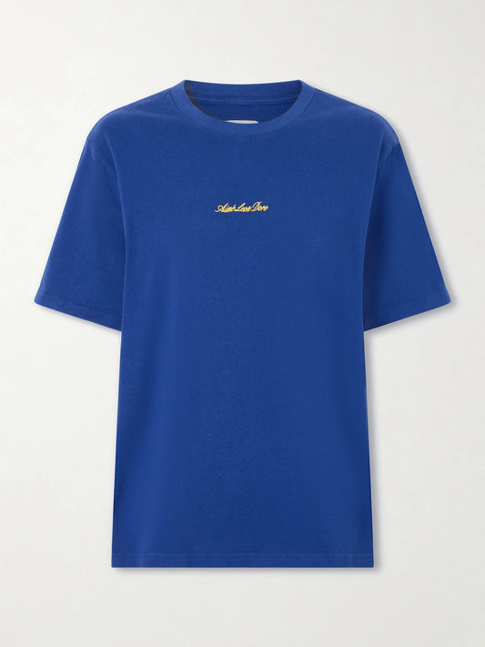 Image of a model wearing Tops. Product name - Logo-embroidered Cotton T-shirt in Navy colour by brand - Aimé Leon Dore
