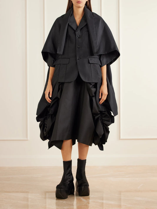 Image of a model wearing Skirts. Product name - Ruffled Drill Midi Skirt in Black colour by brand - Comme des Garçons
