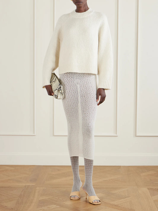 Image of a model wearing Skirts. Product name - Daisy Stretch-econyl Midi Skirt in Cream colour by brand - Wolford
