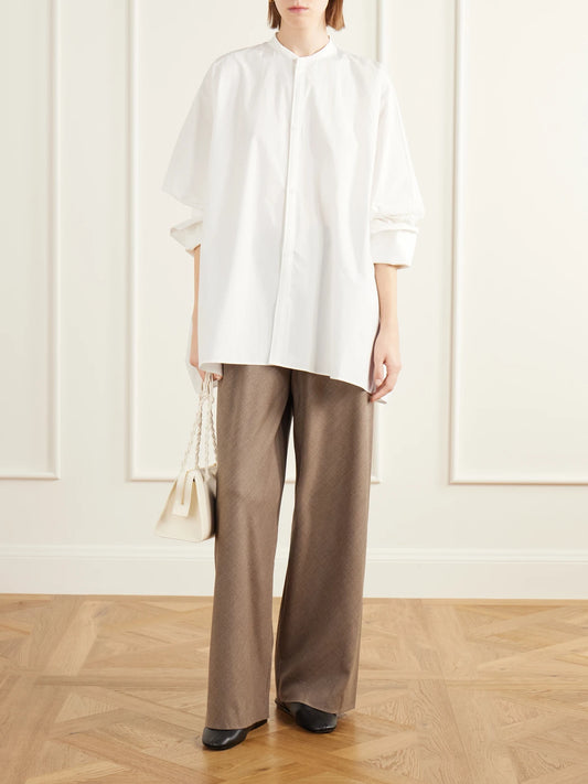 Image of a model wearing Pants. Product name - Wool-blend Fresco Wide-leg Pants in Beige colour by brand - Maria McManus
