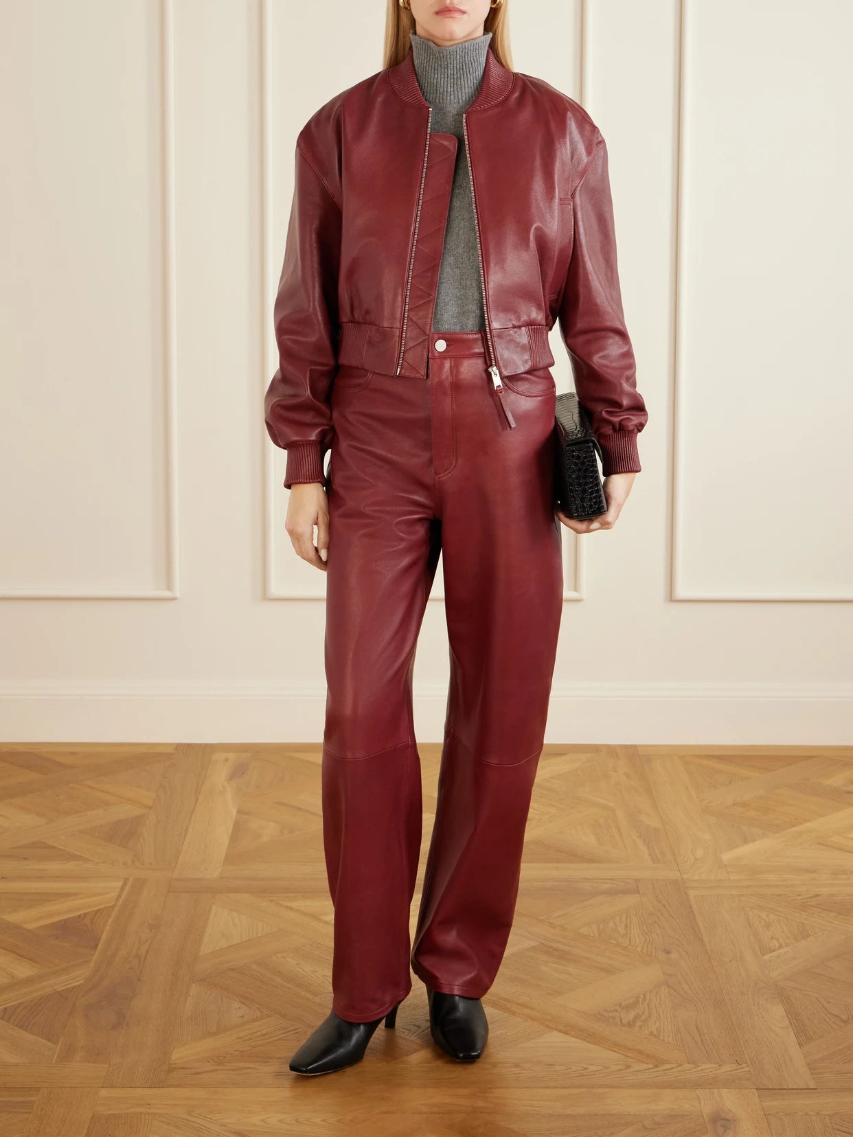 Image of a model wearing Pants. Product name - Leather Wide-leg Pants in Red colour by brand - ARMA