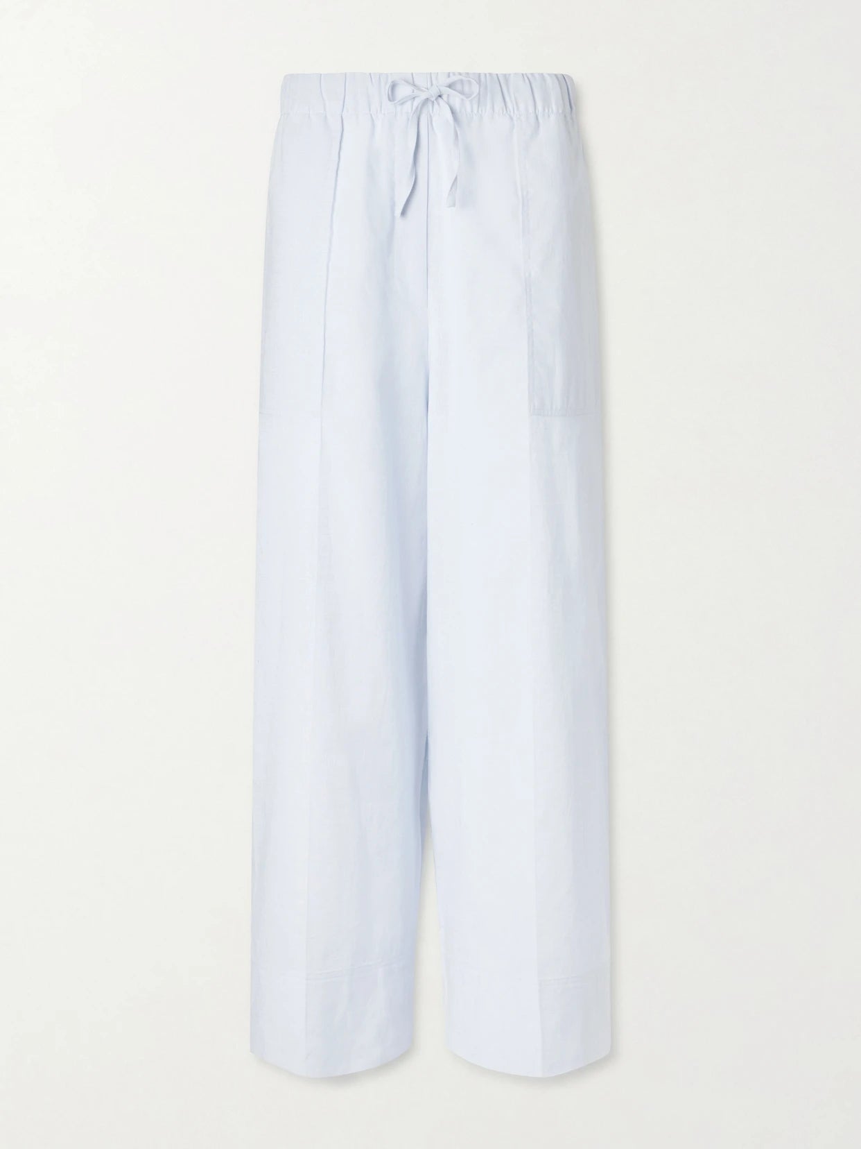 Image of a model wearing Pants. Product name - Cotton And Linen-blend Wide-leg Pants in Light blue colour by brand - TOTEME