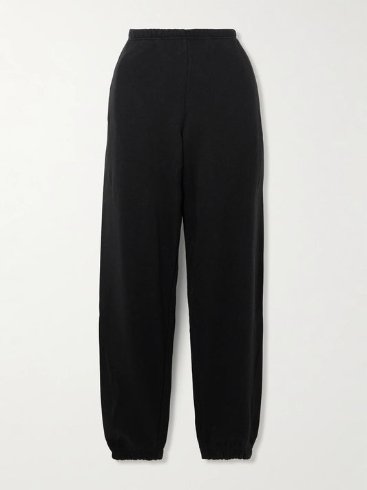 Image of Sleepwear & Loungewear. Product name - Cotton-blend Fleece Track Pants - Onyx in Black colour by brand - SKIMS