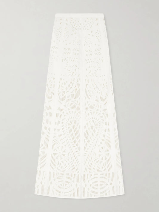 Image of a model wearing Skirts. Product name - Rita Brisé Embroidered Cotton Midi Skirt in White colour by brand - Emporio Sirenuse