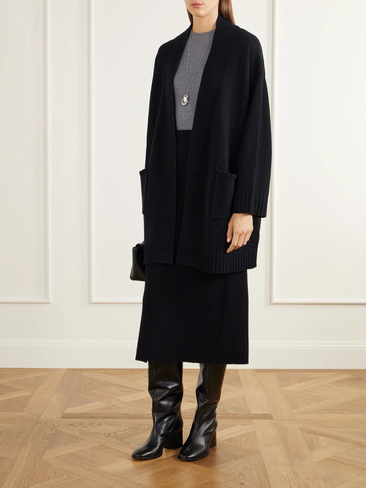 Image of a model wearing Outerwear. Product name - Rib-trimmed Wool And Cashmere-blend Cardigan in Black colour by brand - Allude