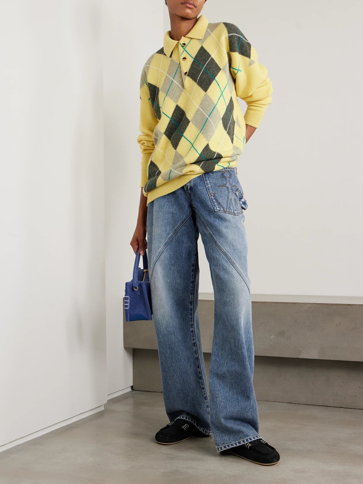 Image of a model wearing Outerwear. Product name - + Pringle Argyle Wool Polo Sweater in Yellow colour by brand - JW Anderson