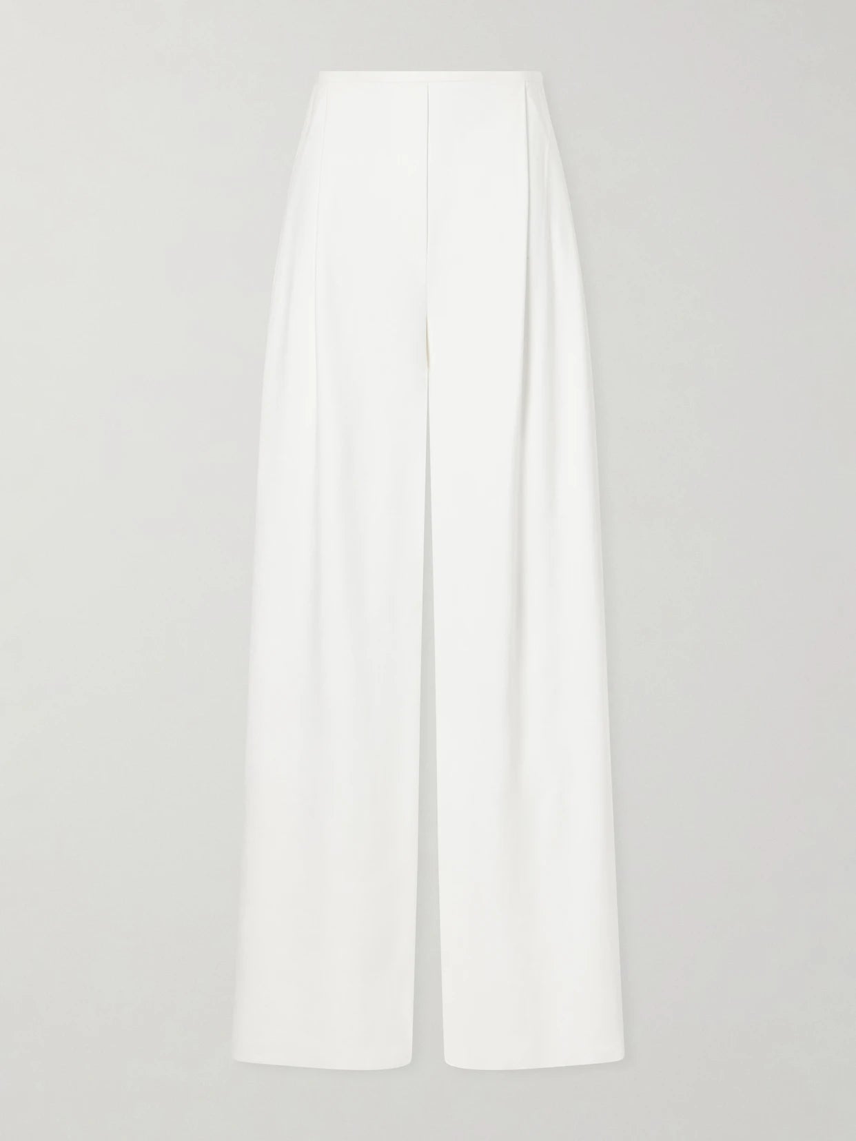Image of a model wearing Pants. Product name - Pleated Woven Wide-leg Pants in White colour by brand - Norma Kamali