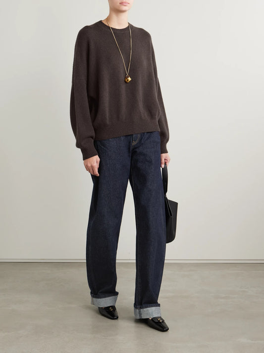 Image of a model wearing Outerwear. Product name - Margaux Oversized Cashmere Sweater in Dark brown colour by brand - KHAITE