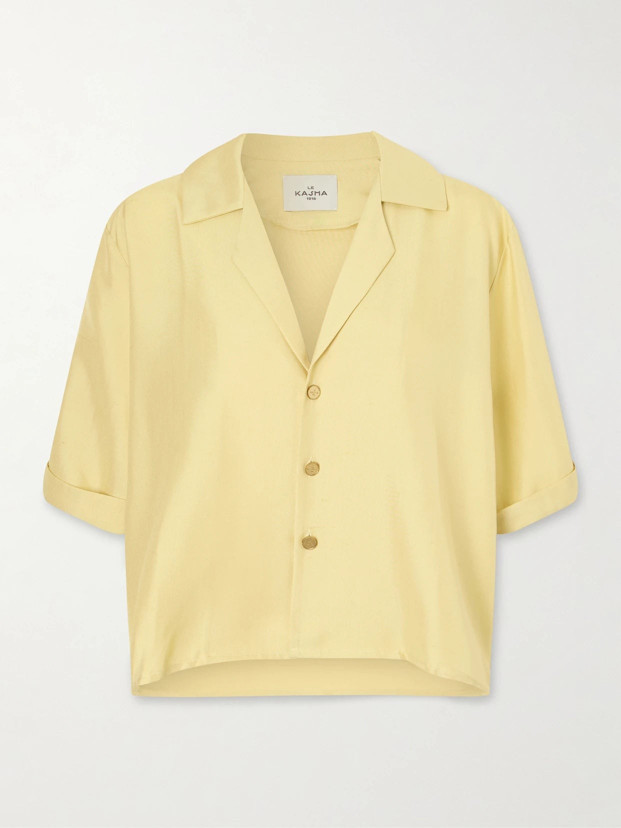 Image of a model wearing Tops. Product name - Abnus Cropped Silk Shirt in Yellow colour by brand - Le Kasha