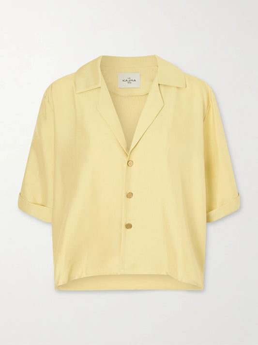 Image of a model wearing Tops. Product name - Abnus Cropped Silk Shirt in Yellow colour by brand - Le Kasha