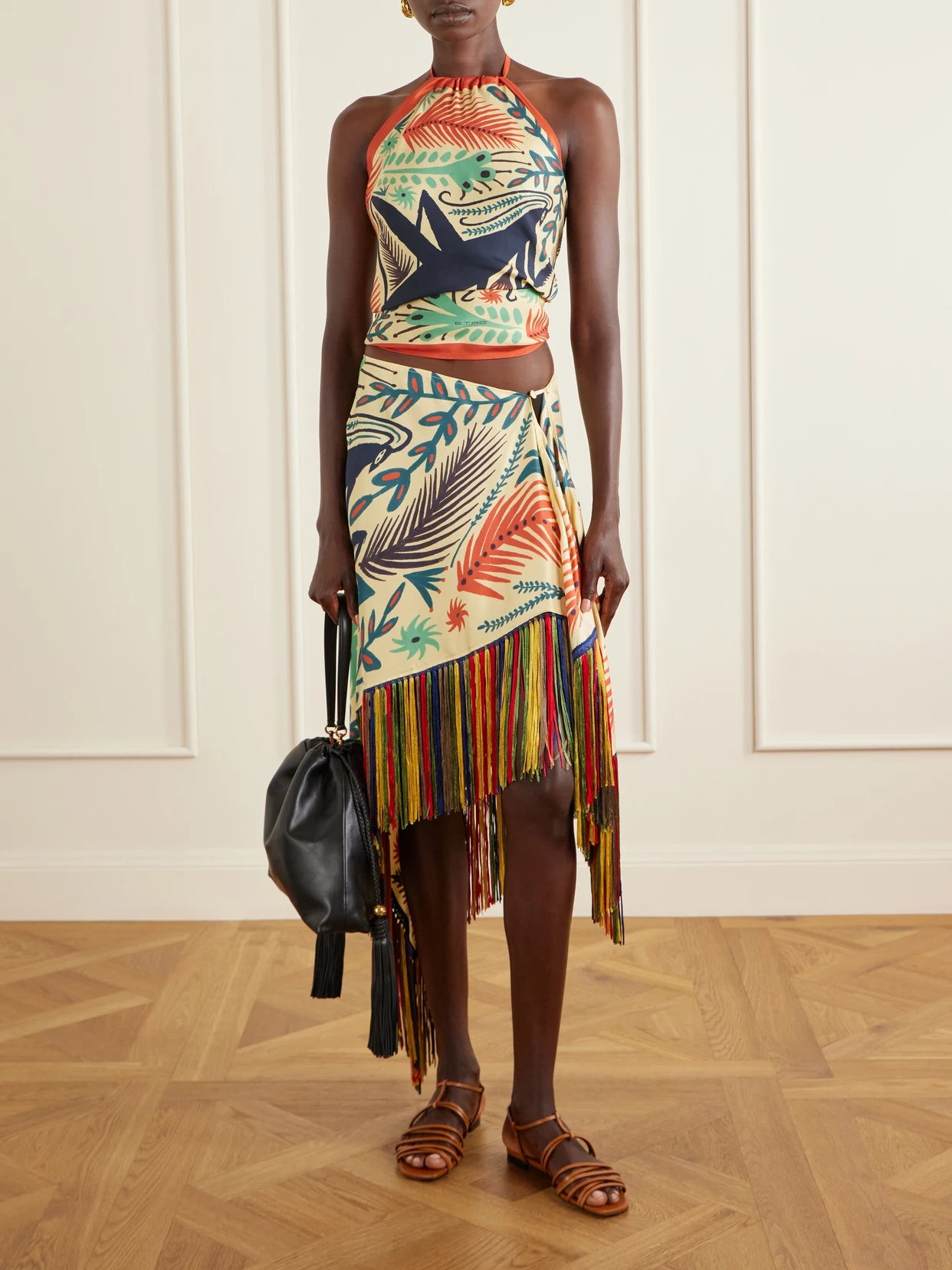 Image of a model wearing Skirts. Product name - Asymmetric Fringed Printed Silk-twill Mini Skirt in Cream colour by brand - Etro