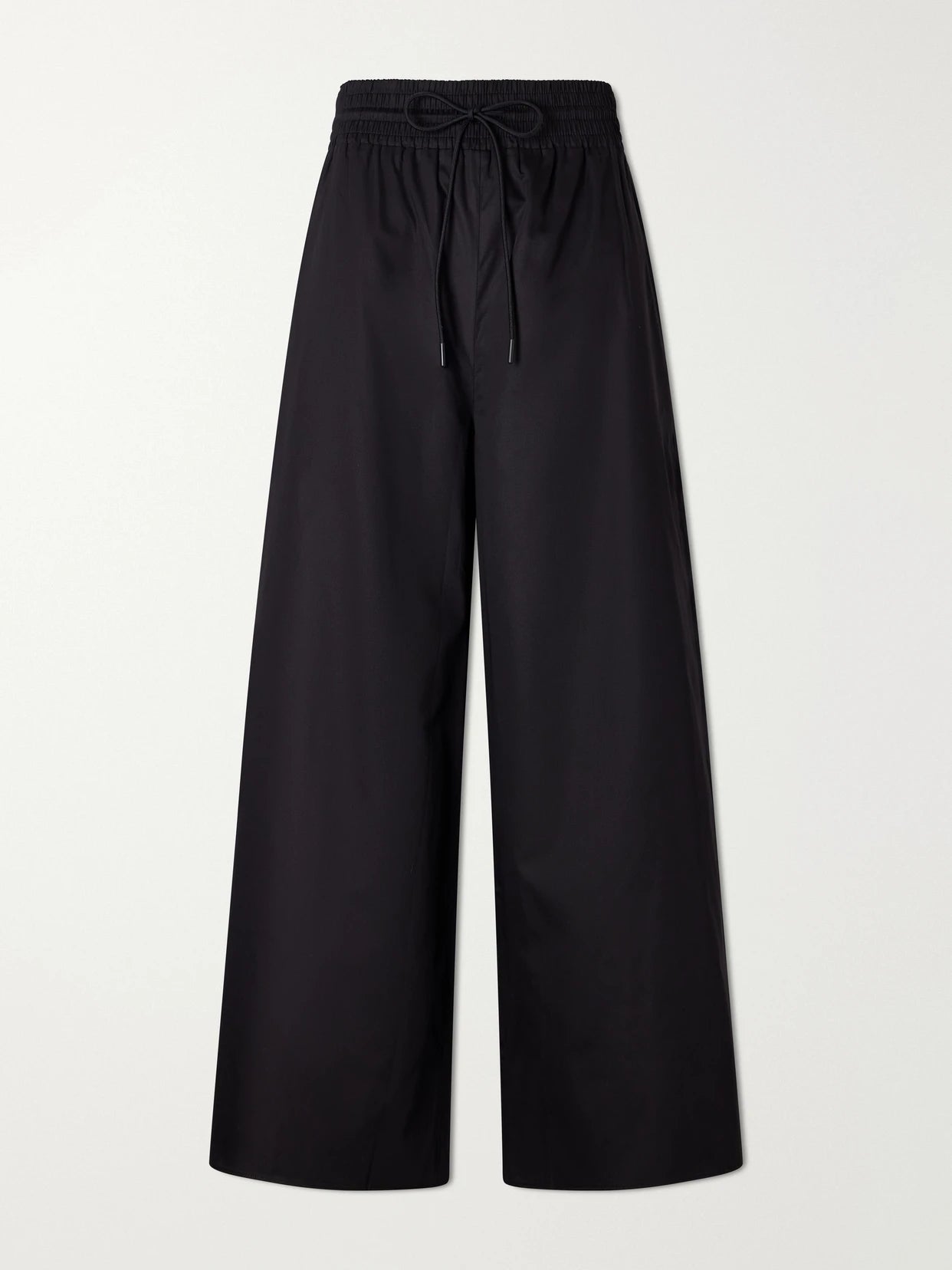 Image of a model wearing Pants. Product name - Cotton Wide-leg Pants in Black colour by brand - La Ligne