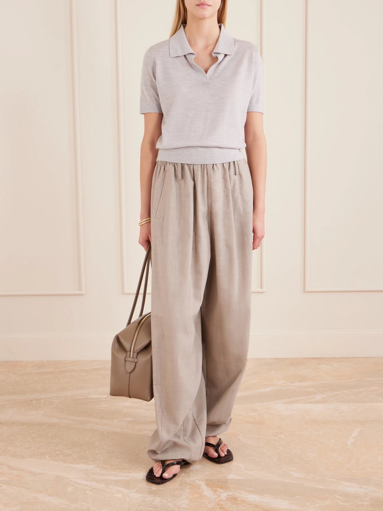 Image of a model wearing Outerwear. Product name - Moni Wool And Cashmere-blend Polo Sweater in Gray colour by brand - Anine Bing