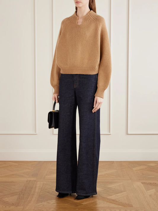 Image of a model wearing Outerwear. Product name - Cain Cashmere Sweater in Tan, Black colour by brand - KHAITE