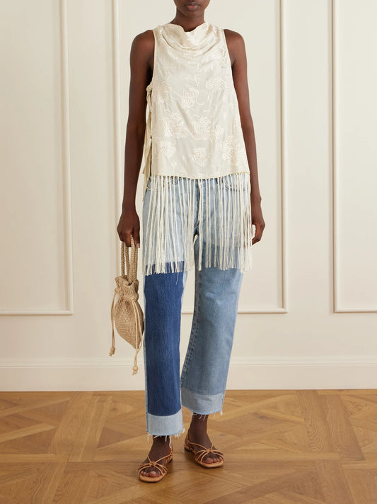 Image of a model wearing Tops. Product name - Priscilla Floral-embroidered Fringed Crepe Vest in Cream colour by brand - Sea