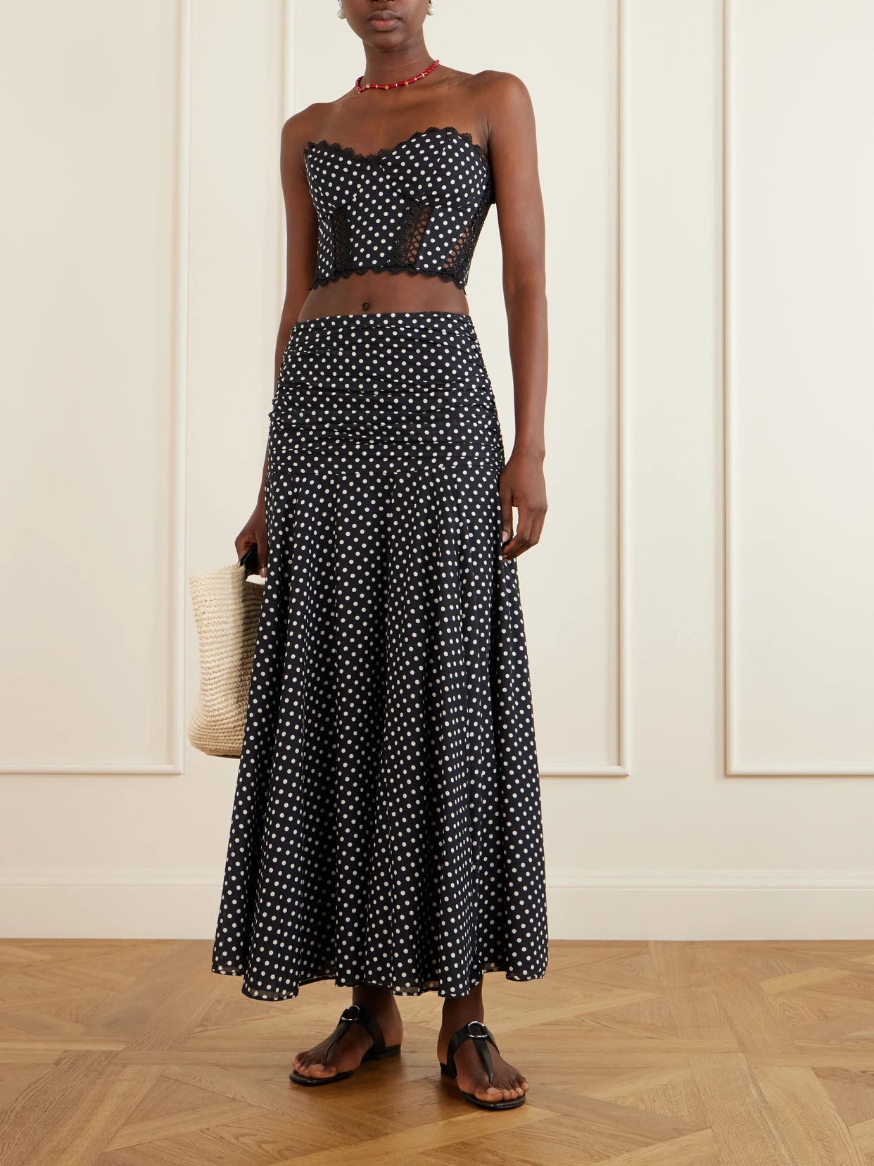 Image of a model wearing Skirts. Product name - Senda Polka-dot Cotton-blend Maxi Skirt in Black colour by brand - Charo Ruiz