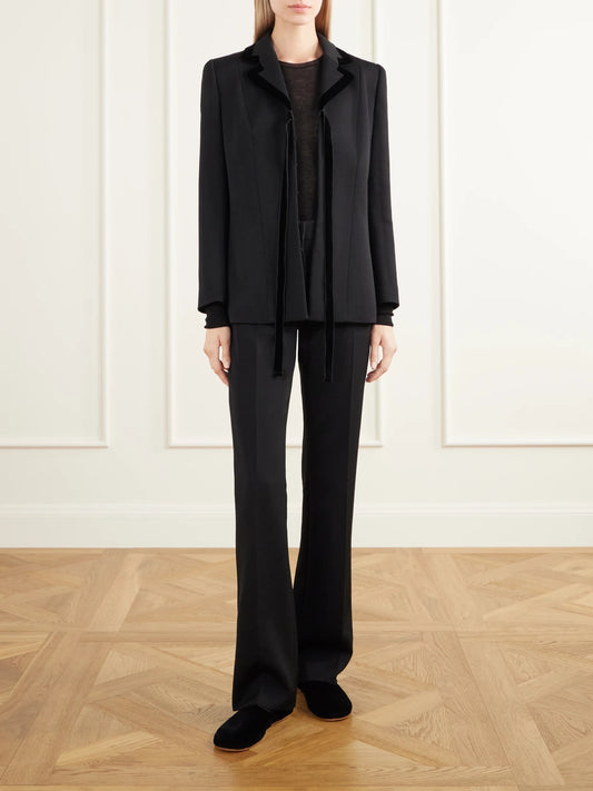 Image of a model wearing Pants. Product name - Kloe Grain De Poudre Wool Straight-leg Pants in Black colour by brand - The Row