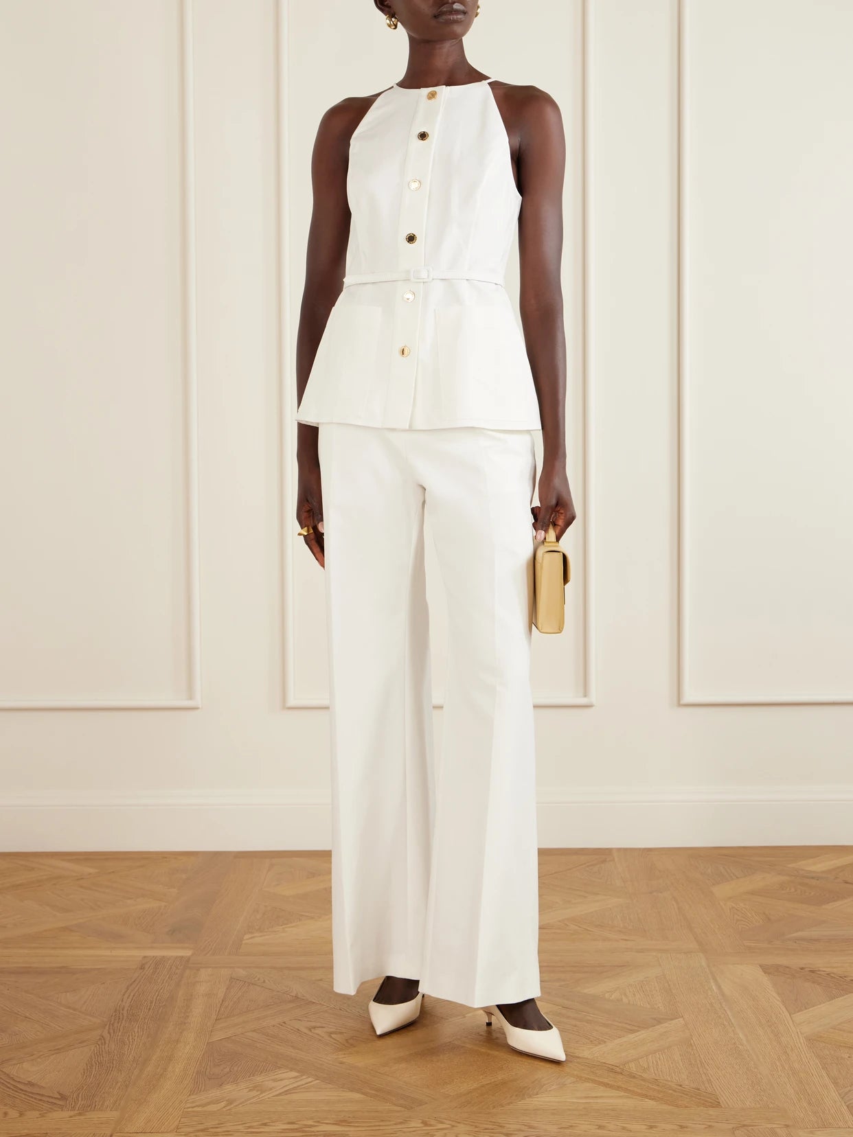 Image of a model wearing Tops. Product name - Belted Cotton-blend Blouse in White colour by brand - Carolina Herrera