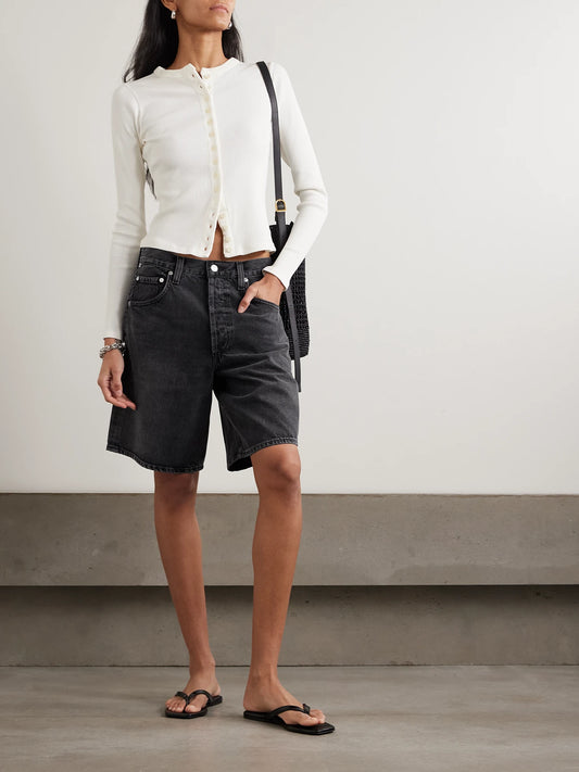 Image of a model wearing Shorts. Product name - Ayla Denim Shorts in Black colour by brand - Citizens of Humanity
