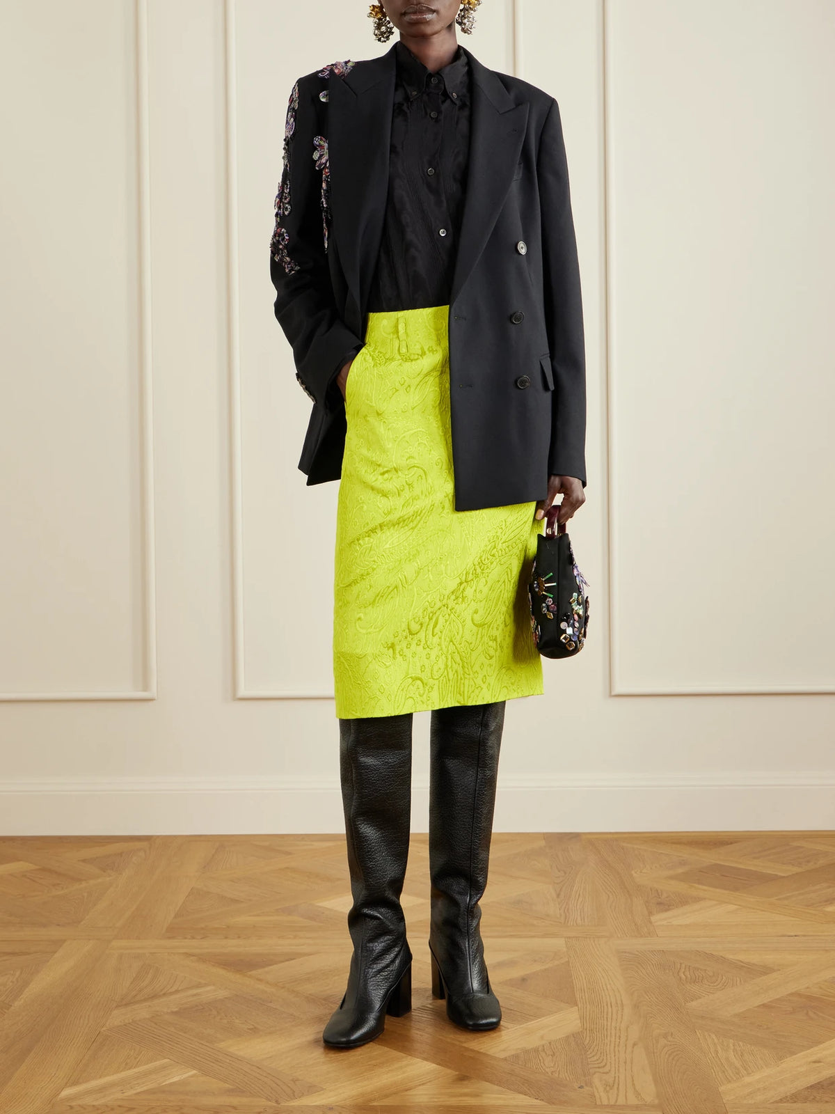 Image of a model wearing Skirts. Product name - Paisley Motif Matelassé Jacquard Midi Skirt in Yellow, Black colour by brand - Dries Van Noten