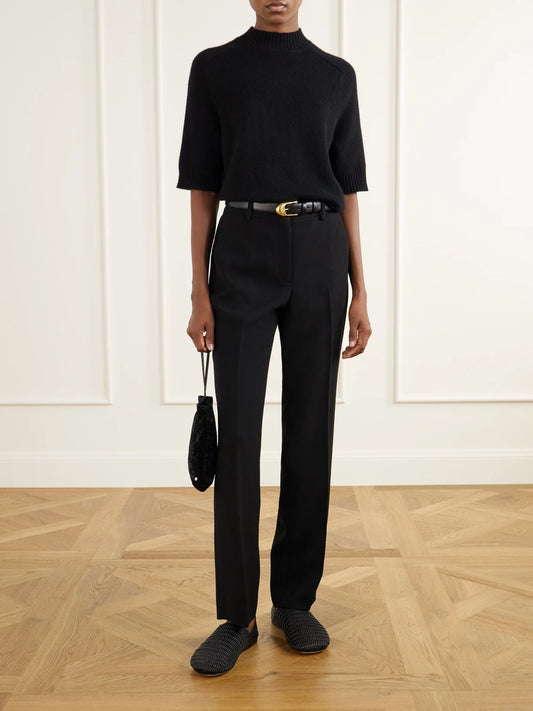 Image of a model wearing Pants. Product name - Crepe Straight-leg Pants in Black colour by brand - Theory